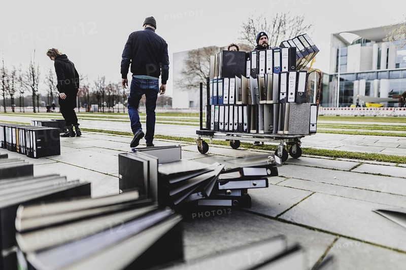 Files are cleared away after a protest action by the German Confederation of Skilled Crafts in front of the Federal Chancellery in Berlin, 26 February 2024. The German Confederation of Skilled Crafts demonstrates against the economic policy of the federal government as well as the high level of bureaucracy and the improvement of location conditions