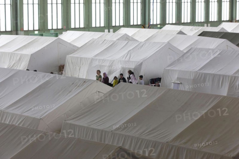 Tents with beds are set up in an emergency shelter for refugees on 9 December 2015 in a former hangar at Tempelhof Airport, Berlin, Berlin, Germany, Europe