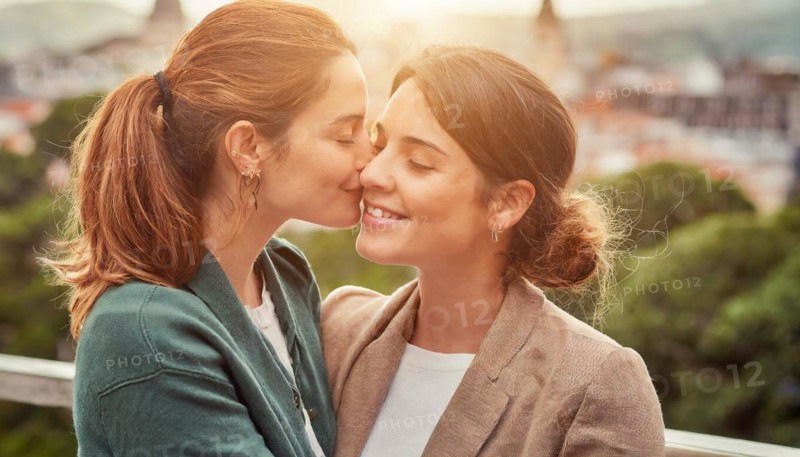 Two women are kissing each other.. Scene is romantic and intimate, AI generated