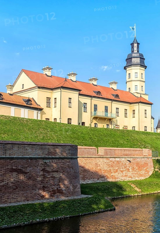 Ancient restored castle with a moat in the Nesvizh city. Belarus