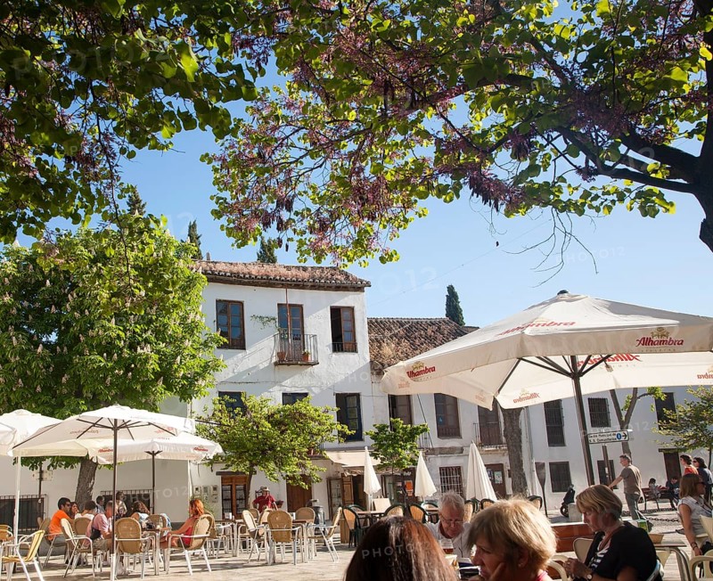 People sitting outside cafes historic square Placeta de San Miguel Bajo in the Albaicin district, Granada, Spain, Europe