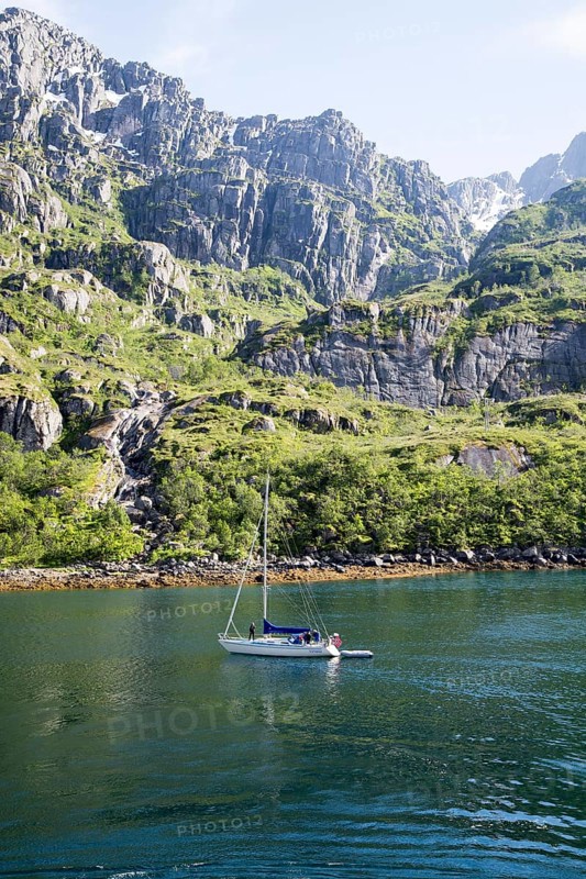Steep sided glacial trough fiord jagged mountain peaks, Trollfjorden, Lofoten Islands, Nordland, northern, Norway, Europe