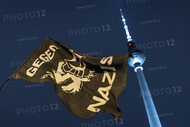 Pictures taken during the demonstration Auf die Strasse! Against Nazi deportation plans of the AfD in front of the Rotes Rathaus in Berlin, 17 January 2024. A banner with the inscription Gegen Nazis in front of the Berlin TV tower