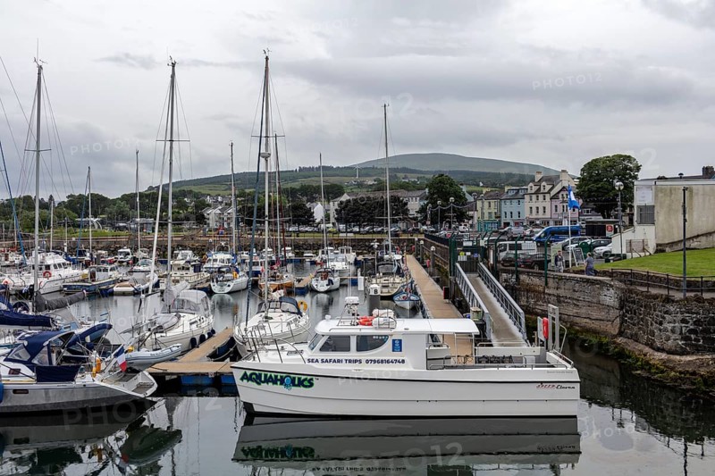 Harbour with many boats and a cloudy mountain in the background, Ballycastle