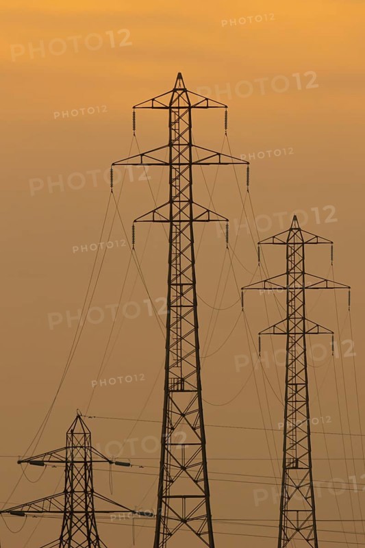 Electricity pylons silhouette at sunset, Kent, England, United Kingdom, Europe