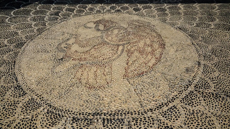 Pebble mosaic with an intricate facial motif, Mandraki, Nisyros, Dodecanese, Greek Islands, Greece, Europe