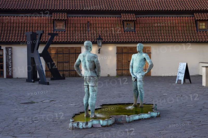 Two male figures peeing, sculpture by the artist David Cerny in front of the Franz Kafka Museum, Prague, Czech Republic, Europe