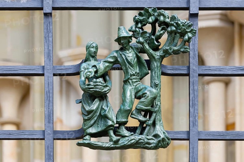 Prague castle, Gothic Metropolitan Cathedral of Saints Vitus, Wenceslas and Adalbert, Decorative figure of daily life scene on a fence, Prague, Czech Republic, Europe