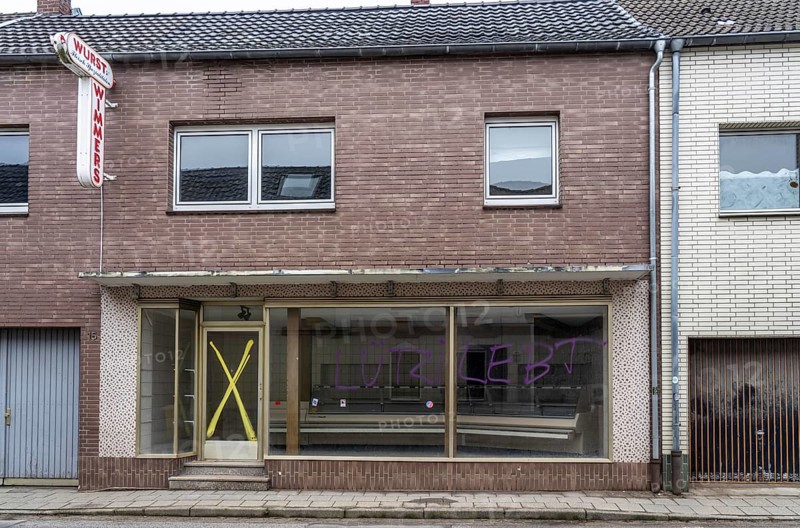 The village of Keyenberg, originally intended to make way for the Garzweiler II open-cast lignite mine, remains standing after the coal compromise, but is largely abandoned and empty, former butcher's shop Wurst Wimmers, North Rhine-Westphalia, Germany, Europe