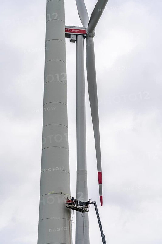 Preparation for the demolition of the tower of a 20 year old wind turbine, in the Werl wind farm, 5 old Enercon E-66 turbines are demolished, 2 new Siemens SG6.6-170 wind turbines replace them, the WTGs produce twice as much energy, 12 MW power, as the 5 old wind turbines, called repowering, Werl, North Rhine-Westphalia, Germany, Europe