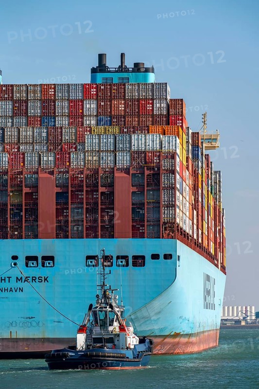 Container ship of the shipping company Maersk Line, Maastricht Maersk, leaving the harbour, towed by two tugs, Euromax Container Terminal, container freighter, in the seaport of Rotterdam, Yangtzehaven, Netherlands, deep-sea port Maasvlakte 2, on an artificial land area off the original coastline