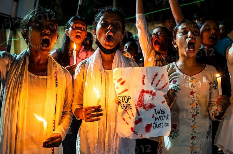 Students holds candle and shout slogans as they participate in a protest against the rape and murder of a doctor inside a hospital in Kolkata, on August 18, 2024 in Guwahati, India. A trainee doctor, 31, was attacked at RG Kar Medical College and Hospital in Kolkata, the capital of West Bengal, last week