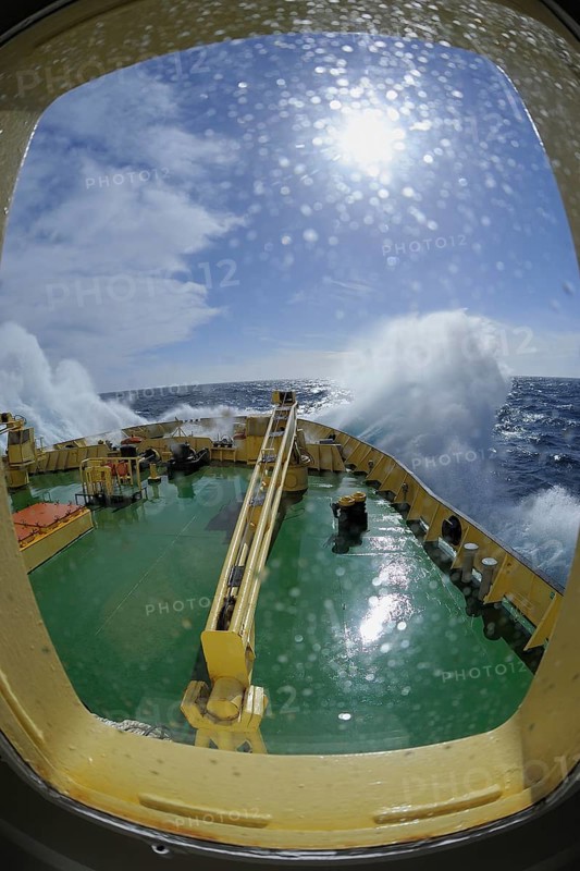 Bullseye with sunb look to bow of Icebreaker Kapitan Khlebnikov in rough seas at the way to Ushuaia, Drake passage, Southern Atlantic Ocean, Anartica, South America