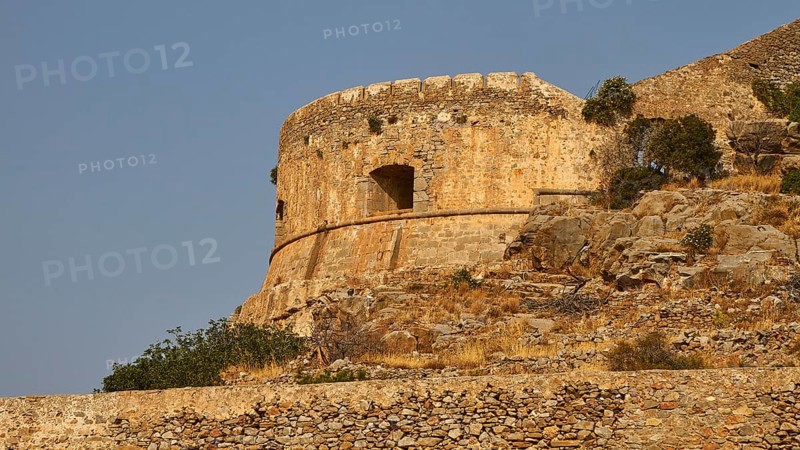 Old round stone tower on rocky ground with clear sky, Venetian Sea Fortress, Leper Island, Spinalonga, Elounda Bay, Mirabello Bay, East Crete, Crete, Greek Islands, Greece, Europe