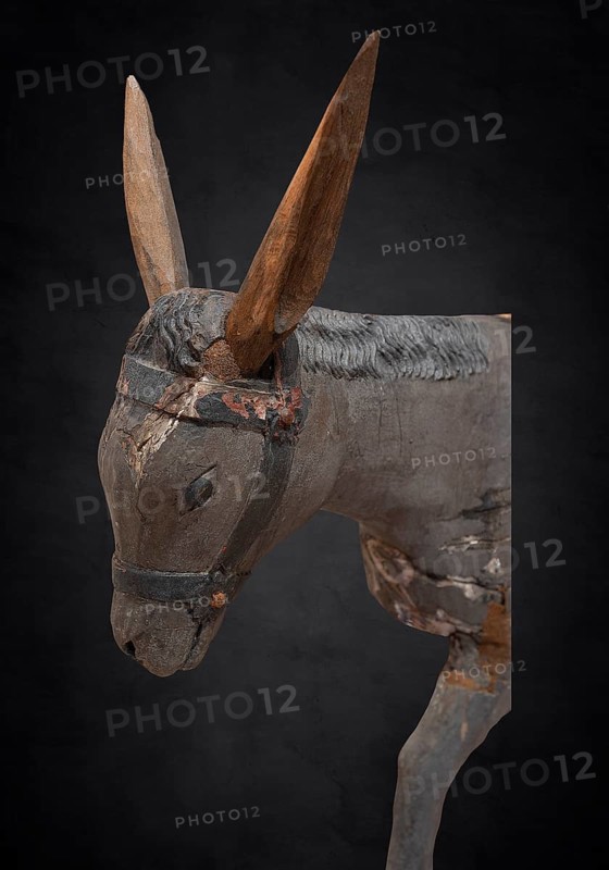 Head of the donkey, on a dark background, detail of the palm donkey, wooden figure from around 1400, Museum Bezau, Vorarlberg, Austria, Europe