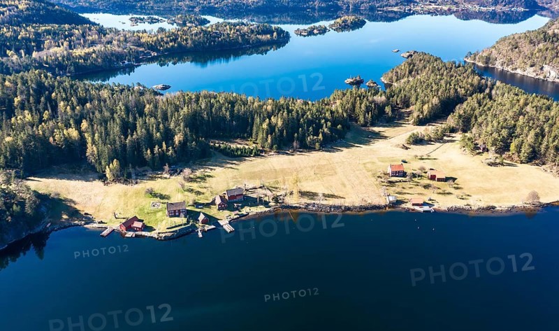 Farm with red houses on an island near Risor, aerial view, norwegean southern coast, Norway, Europe