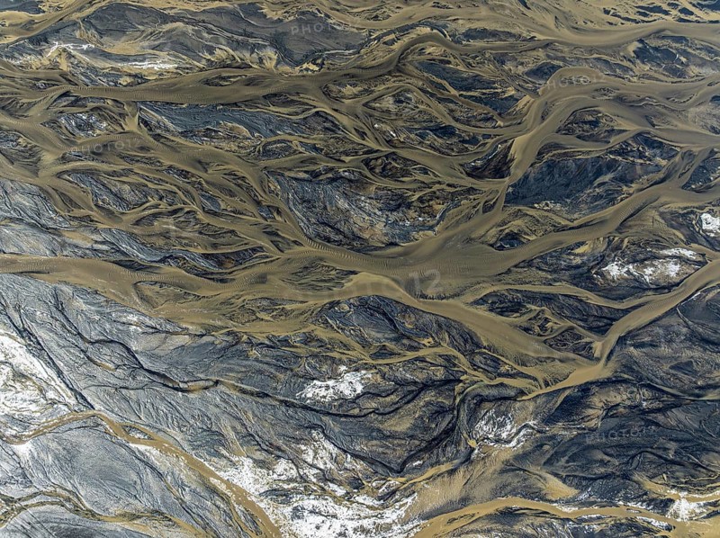 Aerial view, glaicial streams flow across Mælifellssandur, black sand desert, Icelandic highlands, Iceland, Europe