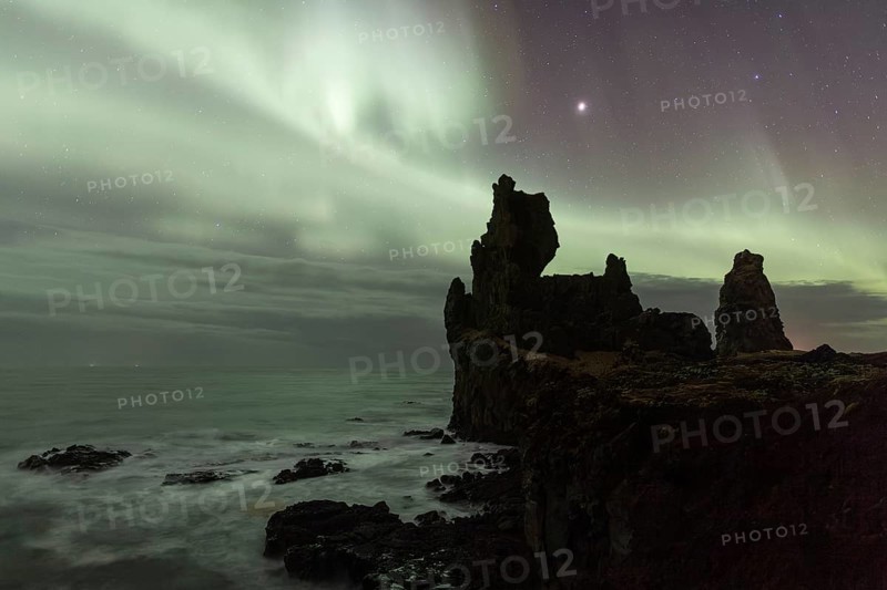 Northern lights or aurora borealis, starry sky, rocky coast, silhouette basalt rock Lóndrangar or Londrangar, Malarríf, Snæfells Peninsula, Snæfellsjökull National Park, Iceland, Europe