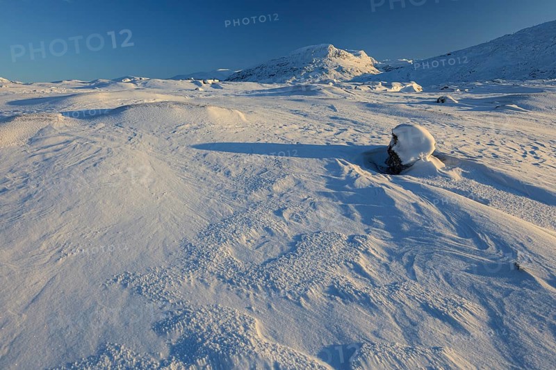 Snowy mountain landscape, evening light, sunny, snow drifts, wind, Björnfjell, Norway, Europe