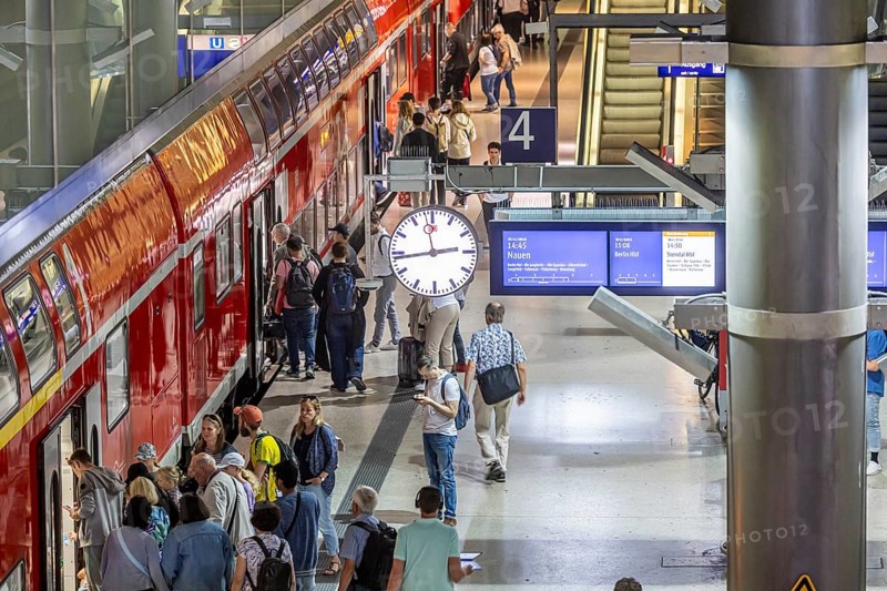 Platform with passengers, Gesundbrunnen station with Deutsche Bahn AG regional train. Berlin, Germany, Europe