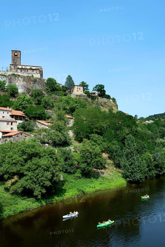 Canoeing at the foot of Chilhac village along the Allier River in Haute-Loire, Auvergne-Rhône-Alpes, France, Europe