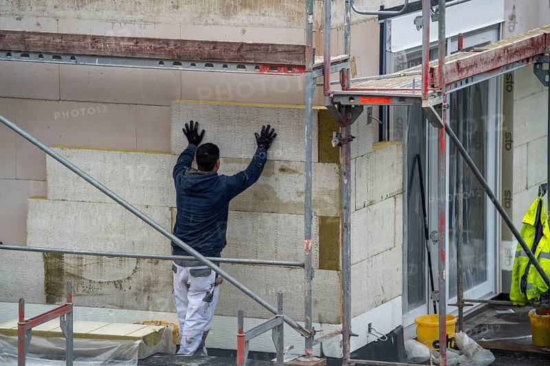Building site, thermal insulation, external insulation, facade insulation, is attached to the facade of a new building, glued, Duisburg, North Rhine-Westphalia, Germany, Europe