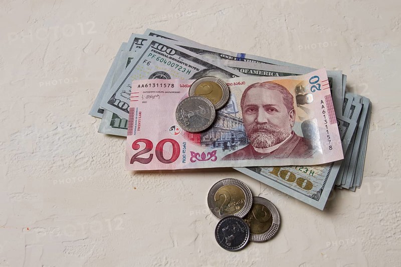 Lari, 20 GEL, Georgian monetary currency, with dollars, banknotes, top view, no people, on the table