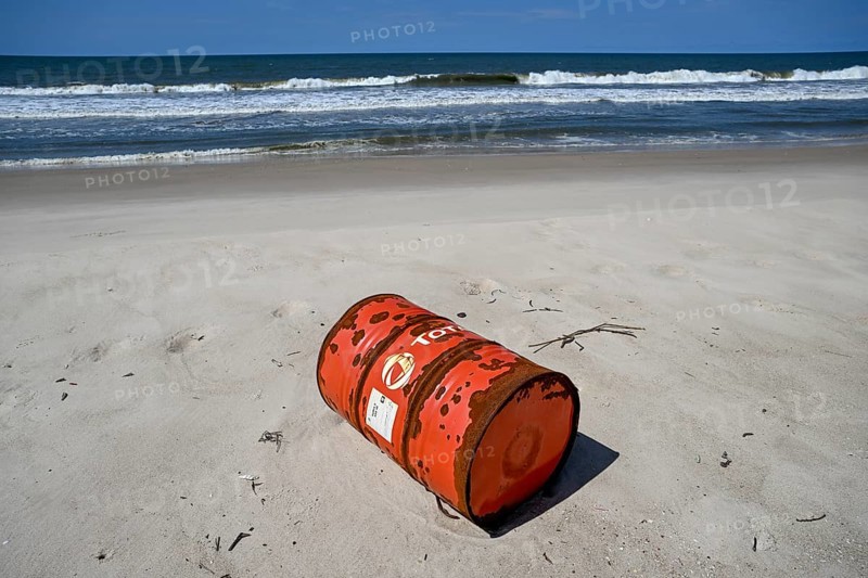 Washed up oil drum on the beach, Loango National Park, Parc National de Loango, Ogooué-Maritime Province, Gabon, Africa