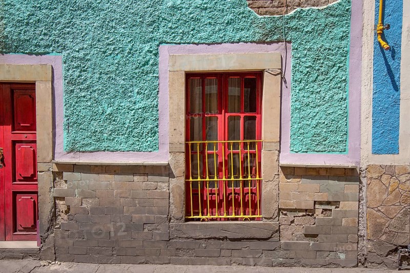 Scenic cobbled streets and traditional colorful colonial architecture in Guanajuato historic city center