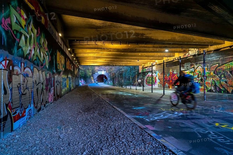 The Nordbahntrasse, a cycle path, footpath, on a former 22 km long railway line, along the west-east axis of Wuppertal, on the northern slope, with many tunnels, viaducts and views of the city, graffiti and basketball area at Brill, Wuppertal, North Rhine-Westphalia, Germany, Europe