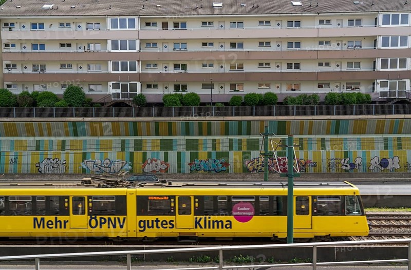 Motorway A40, Ruhrschnellweg, in the through road in Essen, noise barrier, tram, underground railway of the Ruhrbahn, North Rhine-Westphalia, Germany, Europe