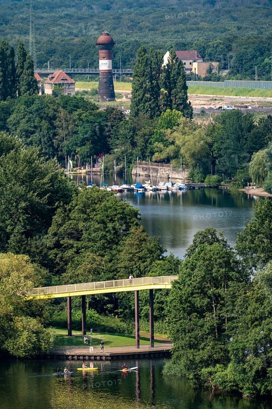 The Sechs-Seen-Platte, a local recreation area in the south of Duisburg, near the Wedau district, 6 former gravel pits, view over the Wolfssee, yellow bridge, behind it the Masurensee and the former railway area, construction site for the 6 Seen Wedau project, North Rhine-Westphalia, Germany, Europe