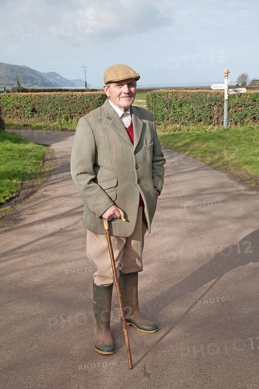 Smartly dressed gentleman out for his morning walk in Bossington, Exmoor national park, Somerset, England, United Kingdom, Europe