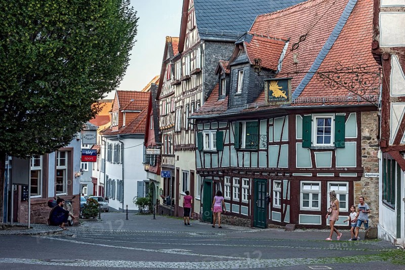 Historic medieval half-timbered houses, row of houses, pedestrian zone, play street, small square in the old town centre, Friedberg, Wetterau, Hesse, Germany, Europe