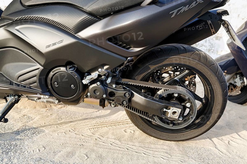 Black scooter, large scooter, maxi scooter, Yamaha TMax 530, drive belt, V-belt, rear wheel, detail, Spain, Europe