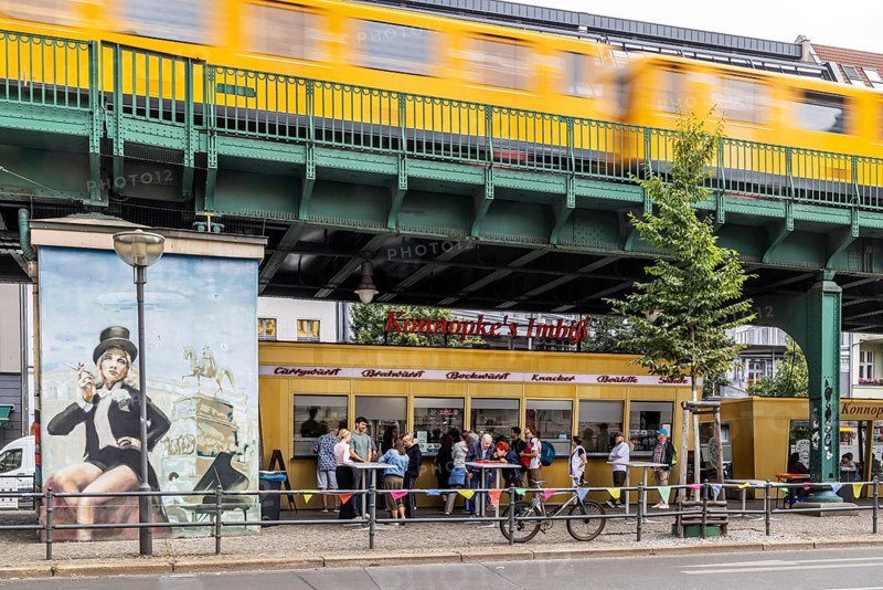 Konnopke's snack bar is cult. Konnopke's in Prenzlauer Berg. It was the first snack bar in East Berlin to introduce the currywurst in 1960. Underground as an above-ground elevated railway on a viaduct. Berlin, Germany, Europe