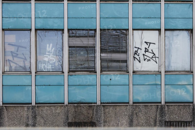 Broken windows and shutters of an abandoned office building loom in Berlin, 29/02/2024