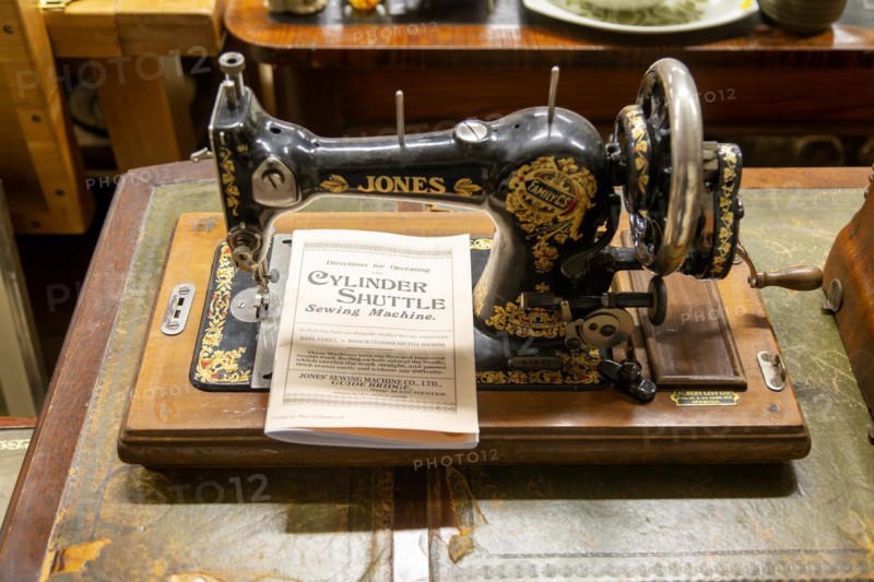 Jones Sewing Machine Company Family Cylinder Shuttle model with instruction manual on display in auction room, UK