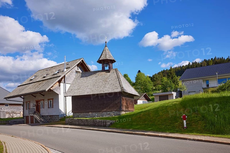 Chapel Unterlehen with road under blue sky with cumulus clouds in Bernau im Black Forest, Black Forest, District Waldshut, Baden-Württemberg, Germany, Europe