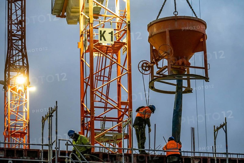 Concrete work, at dusk, on a large construction site building a residential and commercial complex, North Rhine-Westphalia, Germany, Europe