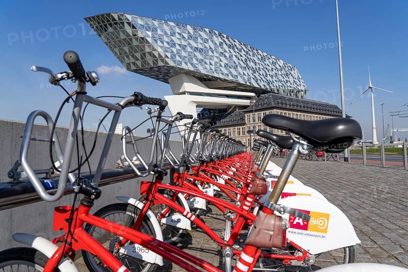 Rental station, drop zone for rental bikes, provider Velo Antwerp, place to park bikes for temporary hire, at the Havenhuis, Antwerp, Flanders, Belgium, Europe