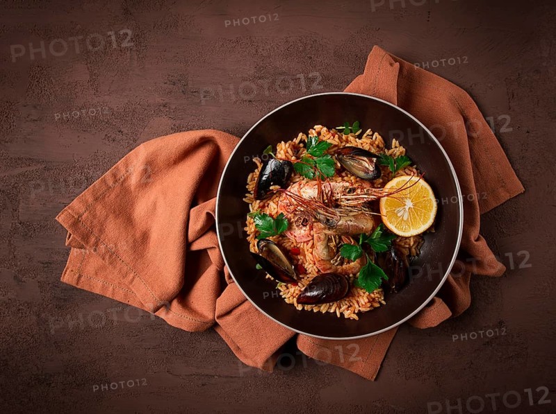 Seafood paella, shrimp and mussels risotto, rice, homemade, top view, no people