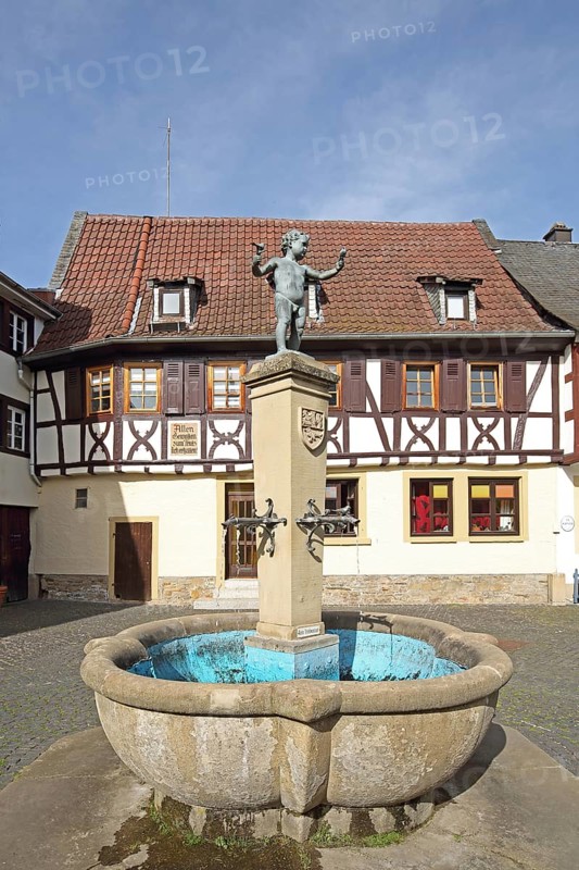 Fountain with sculpture of a boy by Emil Cauer 1938, putto with two bird figures holding hands, Rapportierplatz, Meisenheim, Rhineland-Palatinate, Germany, Europe