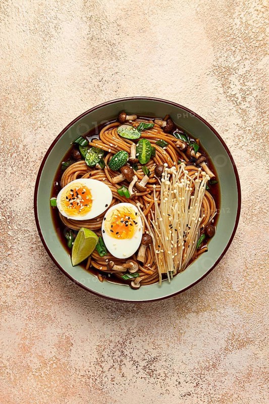 Soba, buckwheat noodles, with enoki mushrooms, shimeji and boiled egg, top view, homemade, no people