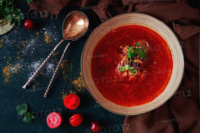 Traditional Georgian dish spicy tomato, Kharcho soup, on a dark background, no people, top view