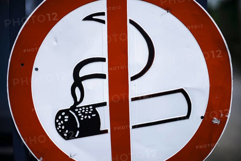 Symbolic photo on the subject of the smoking ban. Prohibition sign with a crossed-out burning cigarette. Berlin, 21.08.2024
