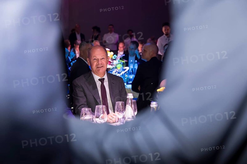 Olaf Scholz, Chancellor of the Federal Republic of Germany (SPD) framed by two people greeting each other at the opening gala for 100 years of IFA in the CityCube, Berlin, 05/09/2024