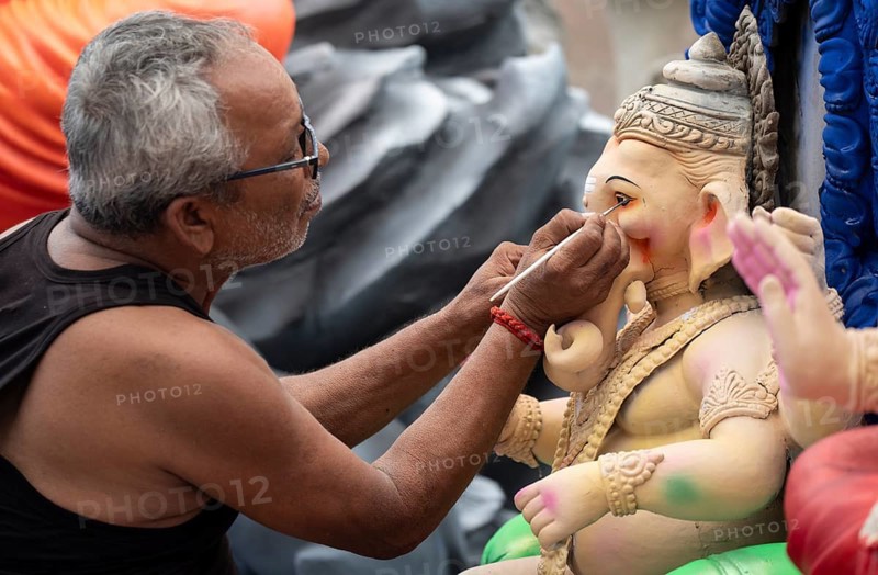 An artisan gives final touches to an idol of the elephant-headed Hindu deity Ganesha at a workshop ahead of the Ganesh Chaturthi festival on September 5, 2024 in Guwahati, Assam, India, Asia