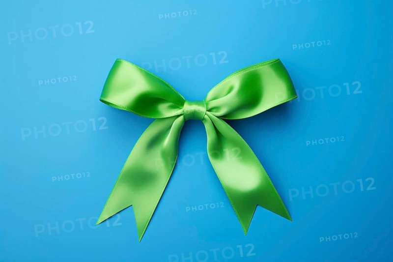 Green silk ribbon on blue background. KI generiert, generiert AI generated