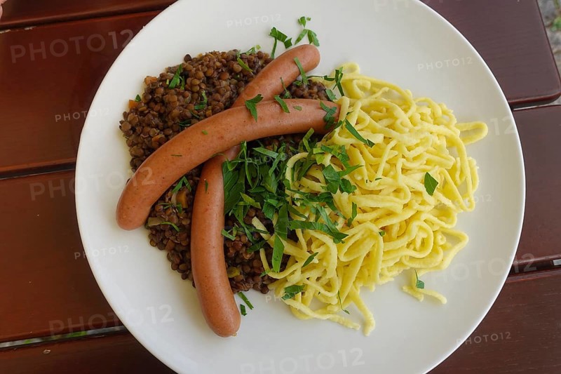 Swabian cuisine, traditional cuisine, home cooking, typical Swabian, hearty, lentils with spaetzle and string sausages, Königliche Post restaurant, restaurant, food photography, old camp, former military area, biosphere area, Münsingen, Swabian Alb, Baden-Württemberg, Germany, Europe